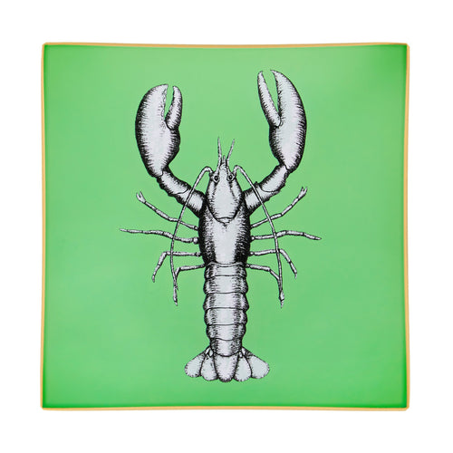 An artisanal, decorative glass valet tray with a lobster illustration on a mid green background finished with an 18kt gold leaf edging