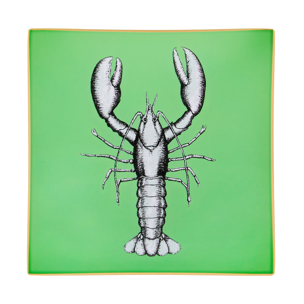 An artisanal, decorative glass valet tray with a lobster illustration on a mid green background finished with an 18kt gold leaf edging